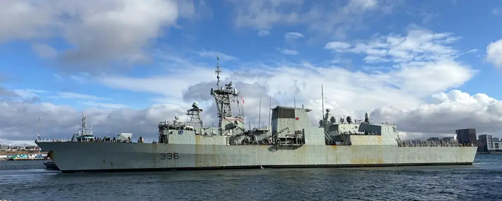 Naval vessel in port supported by Port Call Services and Military Husbanding Services